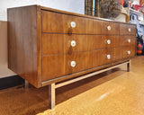 LOW WALNUT NINE-DRAWER DRESSER WITH LUCITE PULLS AND CHROME BASE