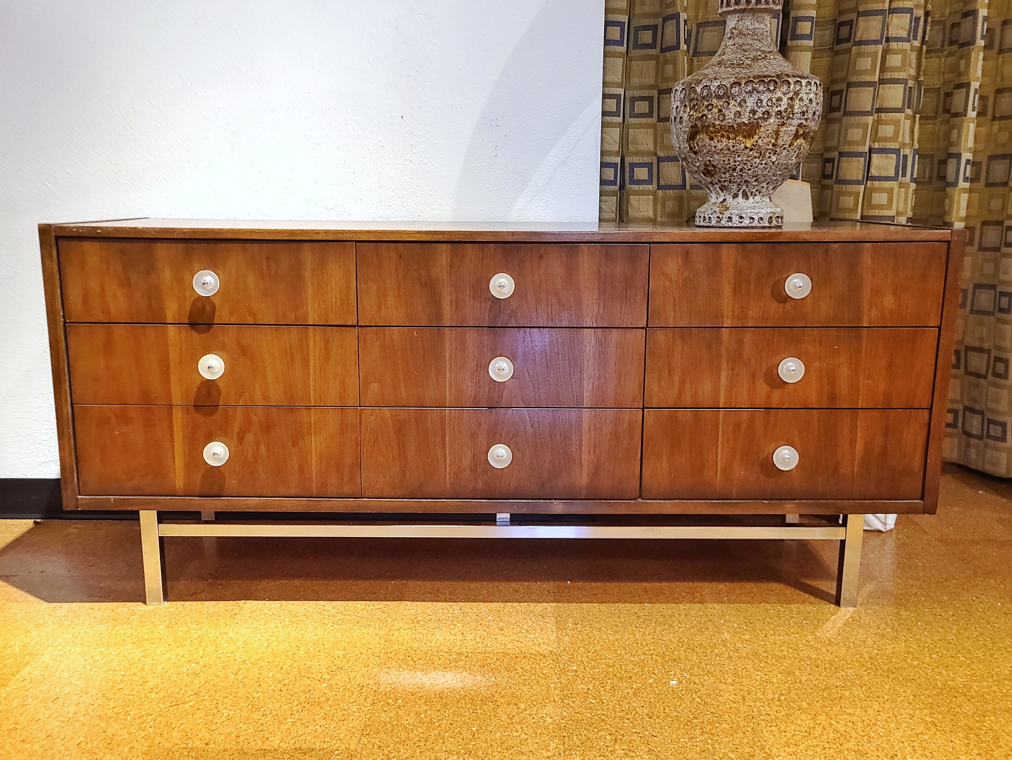LOW WALNUT NINE-DRAWER DRESSER WITH LUCITE PULLS AND CHROME BASE