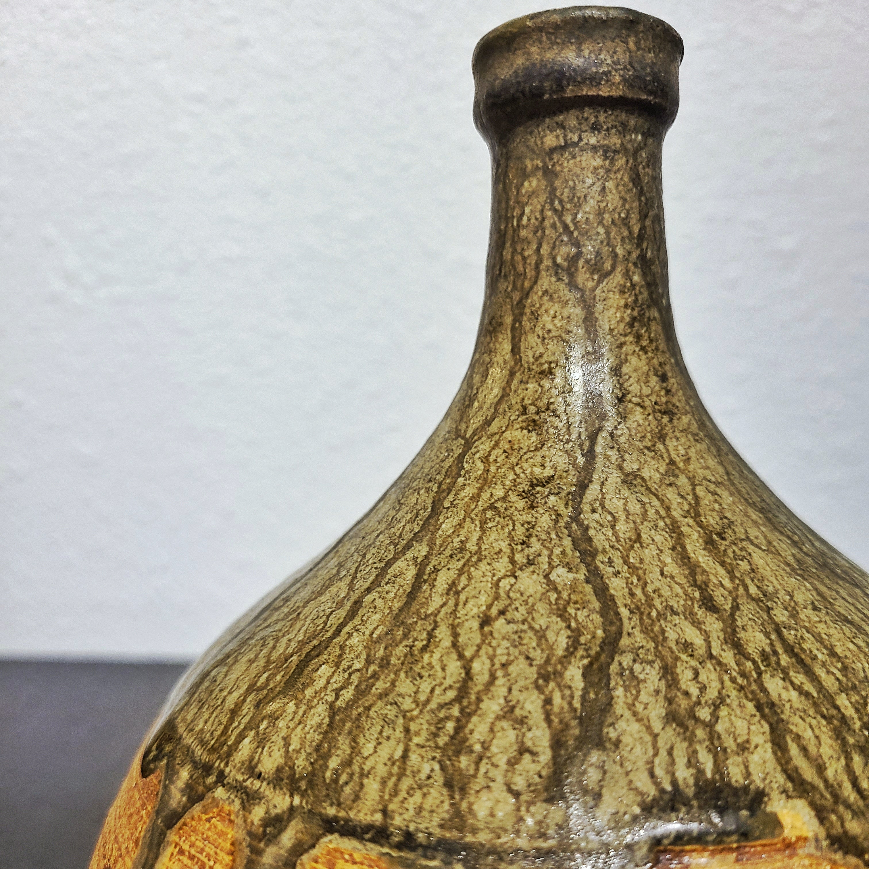 BULBOUS THIN NECKED STUDIO POTTERY VASE WITH GREEN DRIP