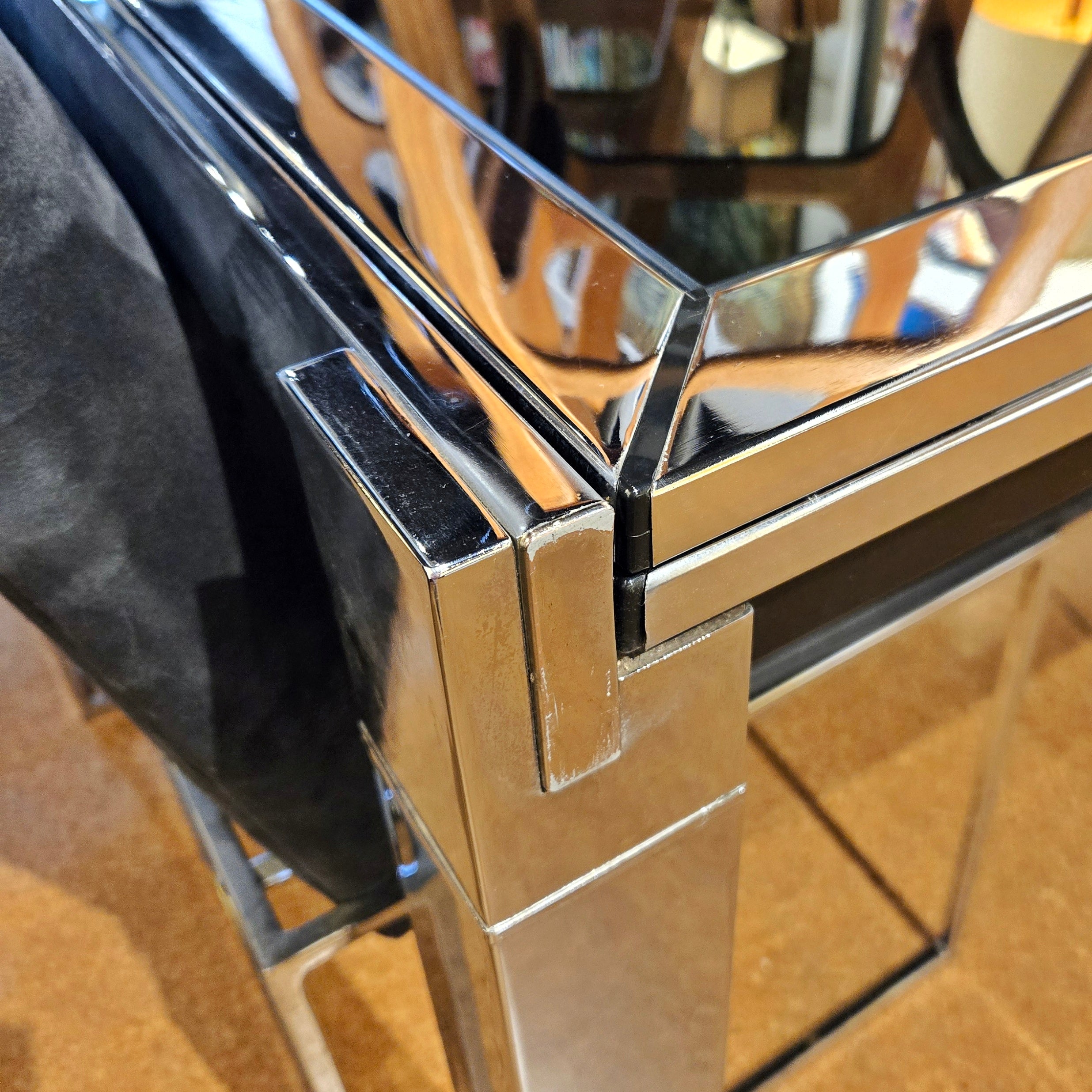 GLASS-TOP CHROMED STEEL DRAW-LEAF TABLE IN THE STYLE OF MILO BAUGHMAN