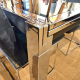 GLASS-TOP CHROMED STEEL DRAW-LEAF TABLE IN THE STYLE OF MILO BAUGHMAN