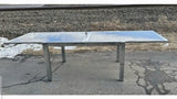 GLASS-TOP CHROMED STEEL DRAW-LEAF TABLE IN THE STYLE OF MILO BAUGHMAN
