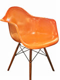 ORANGE EAMES MOLDED FIBERGLASS ‘DAW’ ARMCHAIR WITH NEW DOWEL BASE (2 AVAILABLE)