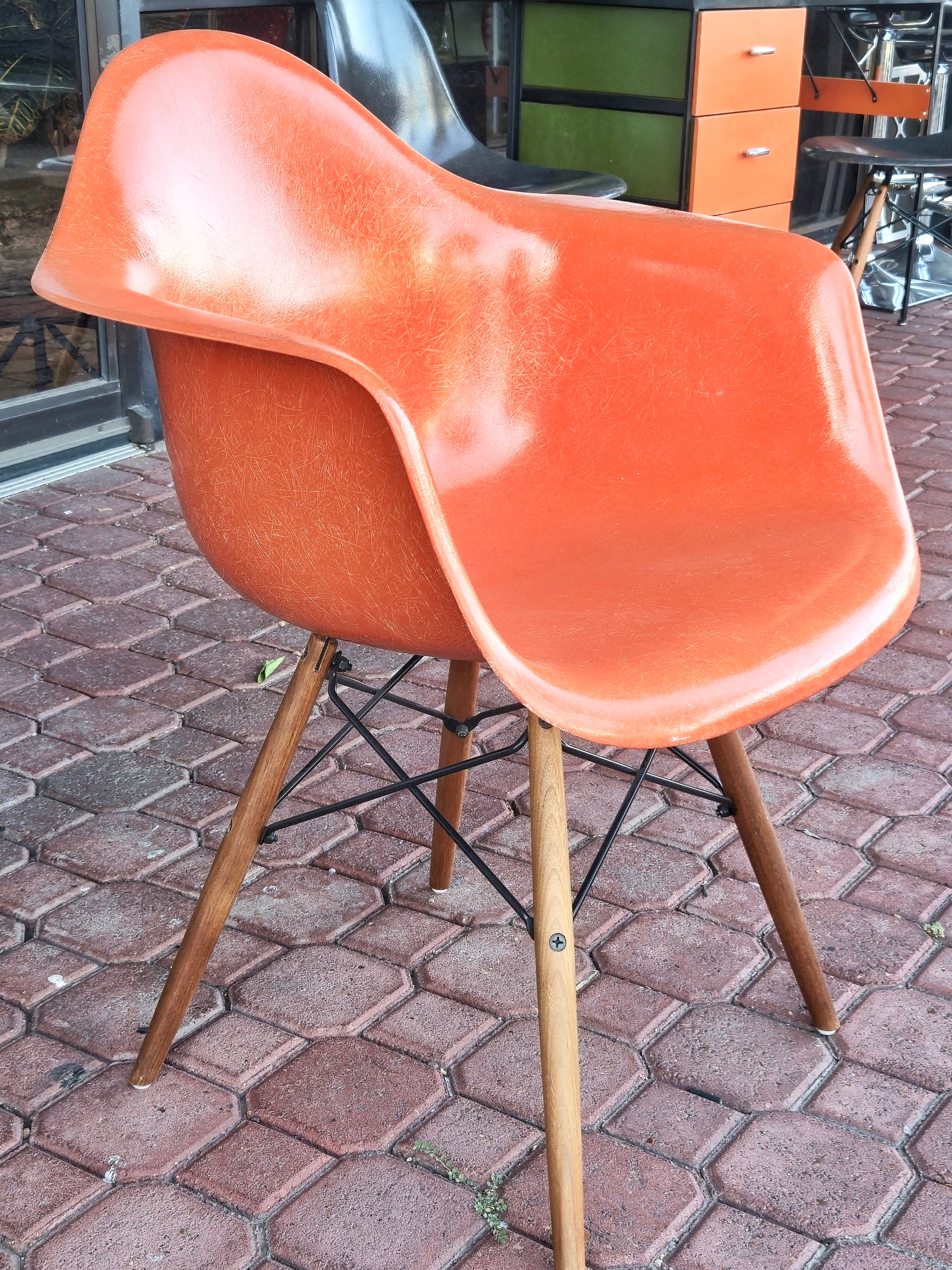 ORANGE EAMES MOLDED FIBERGLASS ‘DAW’ ARMCHAIR WITH NEW DOWEL BASE (2 AVAILABLE)