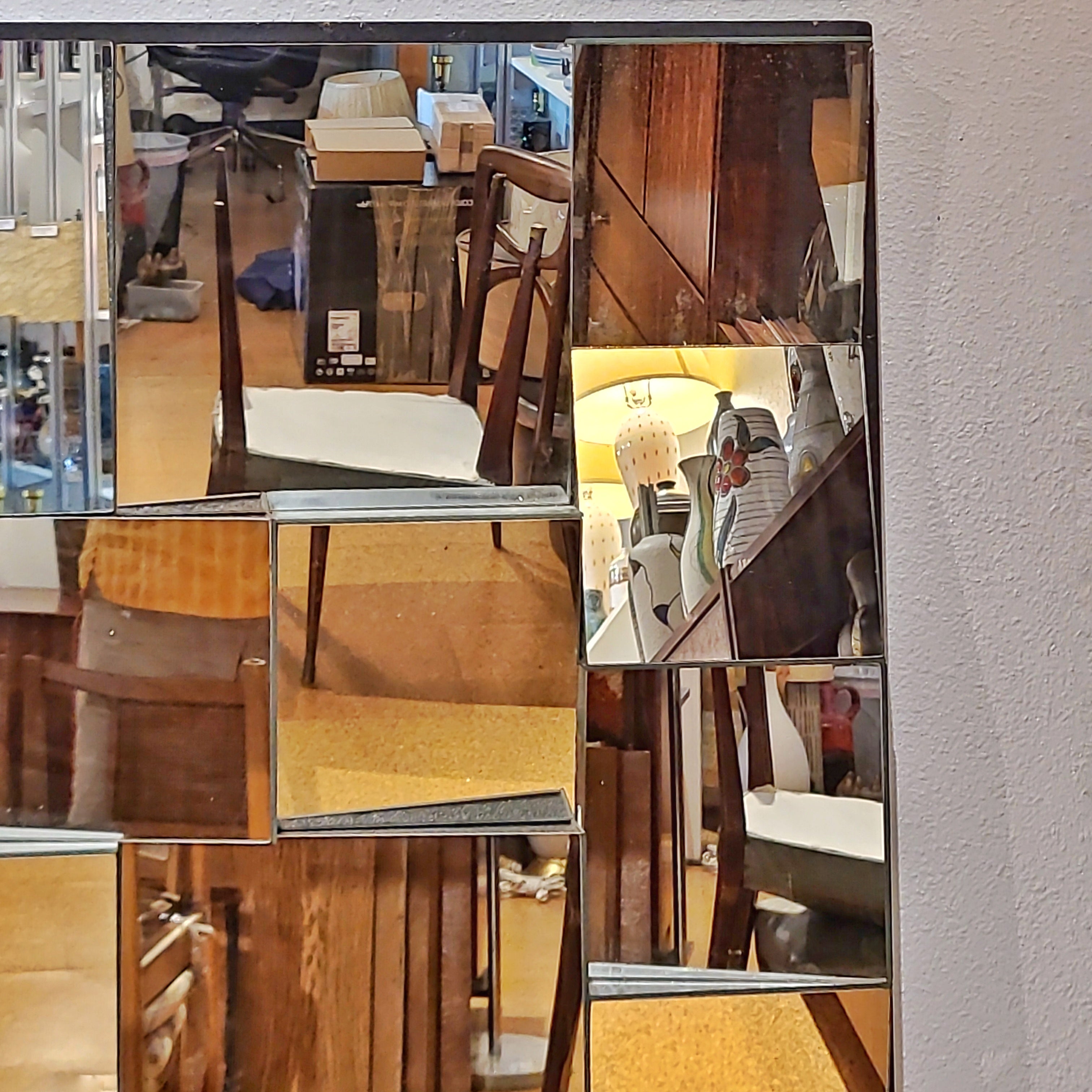 LARGE FACETED WALL MIRROR IN THE STYLE OF NEAL SMALL