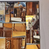 LARGE FACETED WALL MIRROR IN THE STYLE OF NEAL SMALL
