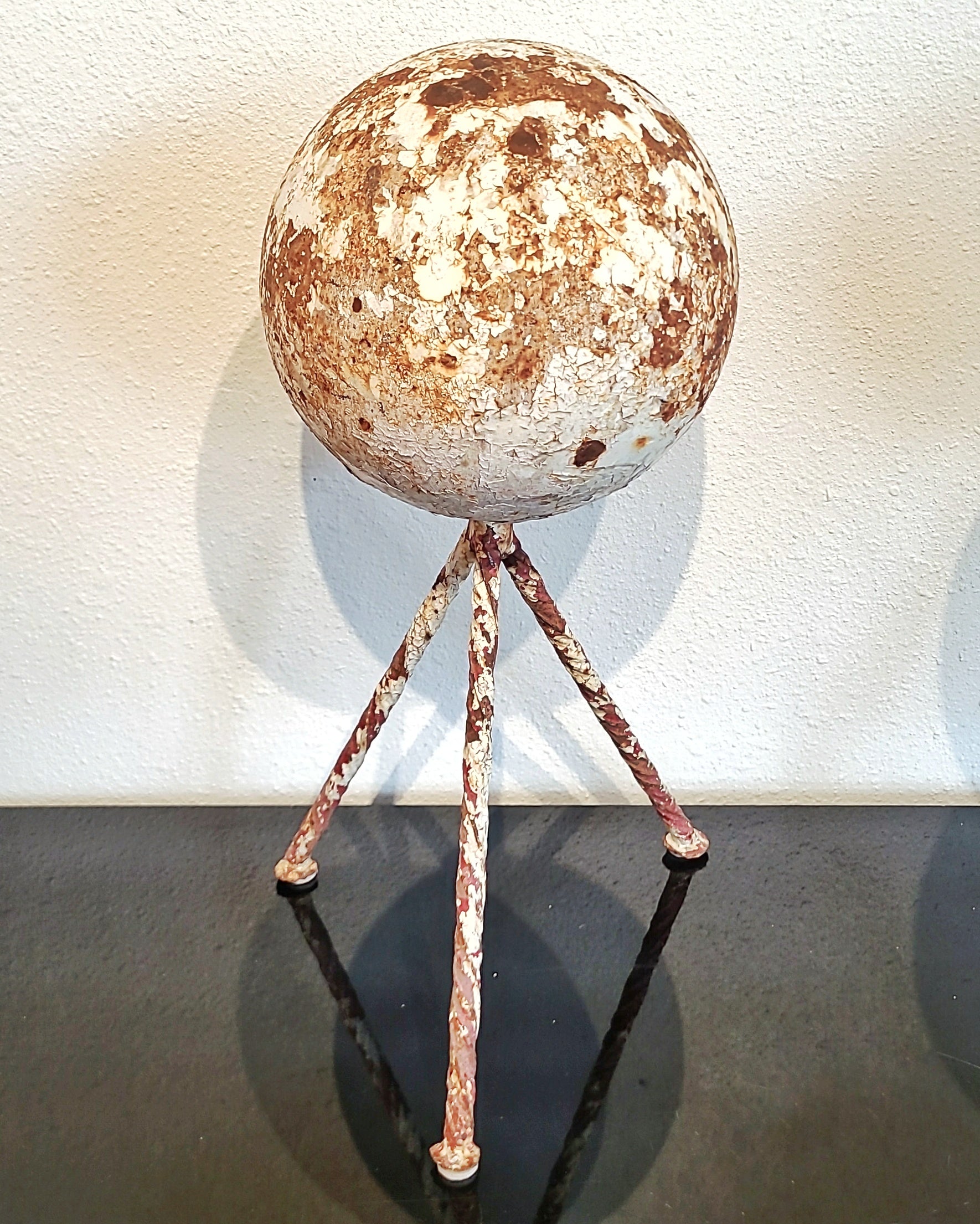 HEAVY IRON GARDEN SPHERE ON TWISTED IRON TRIPOD BASE (1940s)