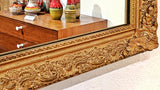 LARGE MIRROR IN A LATE BAROQUE/ROCOCO STYLE GILT FRAME