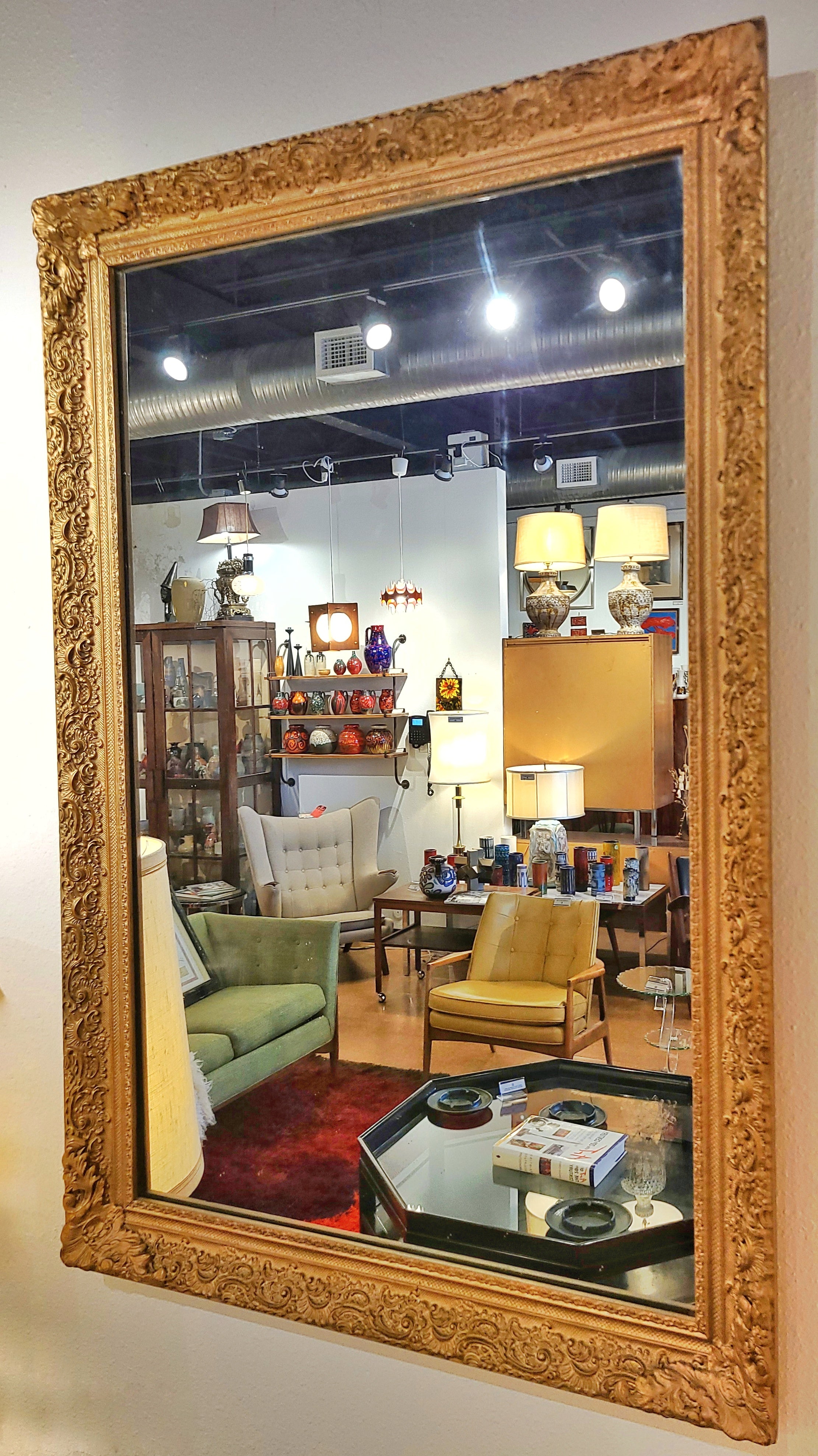 LARGE MIRROR IN A LATE BAROQUE/ROCOCO STYLE GILT FRAME